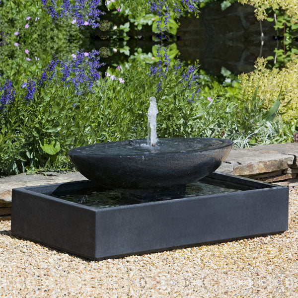 Zen Water Fountains Collection Image of Recife Outdoor Bubbler Water Fountain in action on crushed gravel.