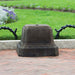 Smithsonian Egg and Dart Pedestal on concrete in the backyard