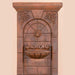 St . Helena Fountain with base concrete spout against brown background upclose.
