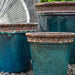 Baia Planter - Beachcomber Aqua - Set of 4 on gravel in the backyard upclose