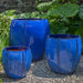 Rib Vault Planter - Riviera Blue - S/3 on gravel in the backyard
